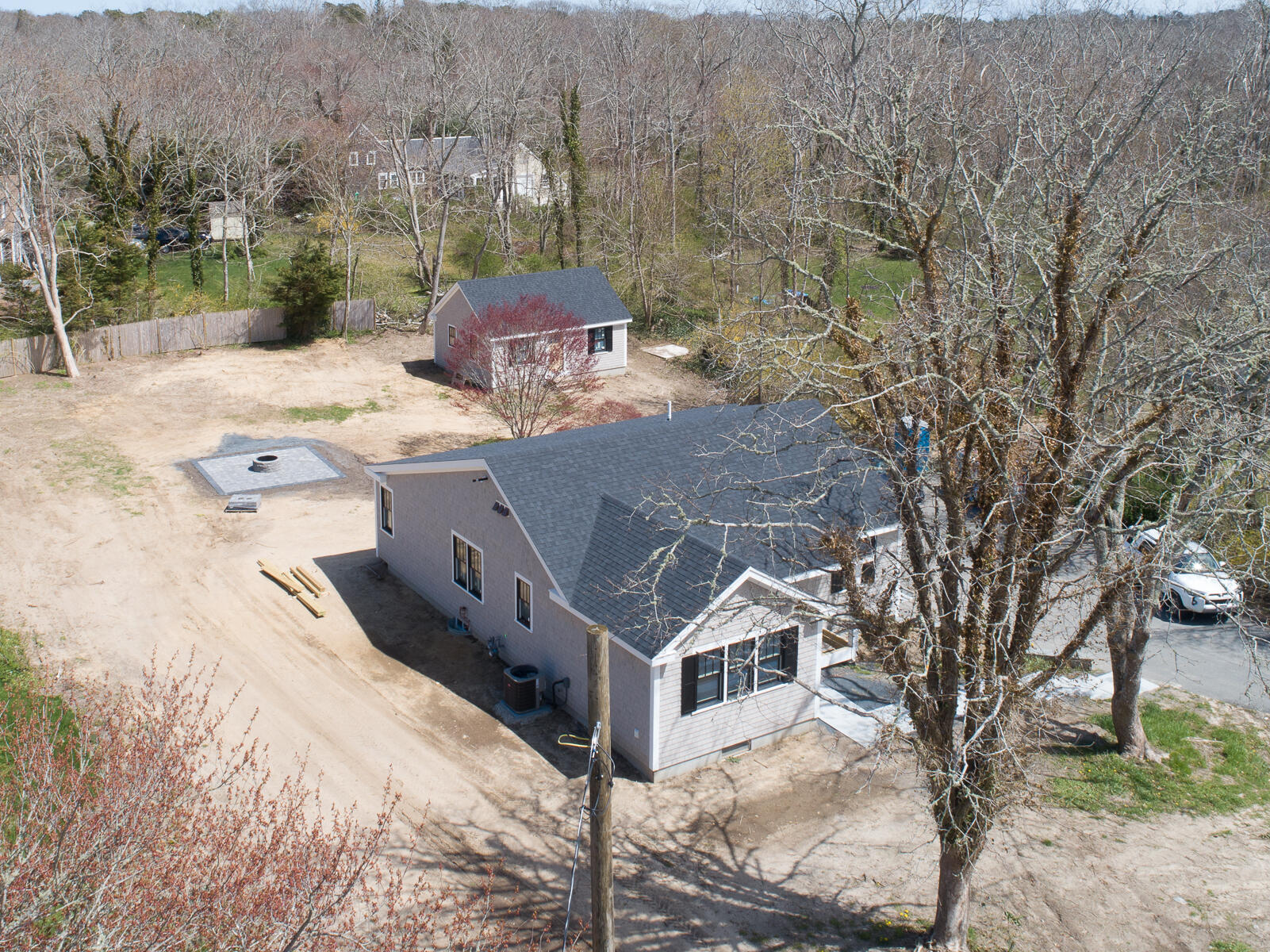 86 West Road Orleans, MA 02653 - Photo 10 of 16 a view of a house with a yard covered with snow