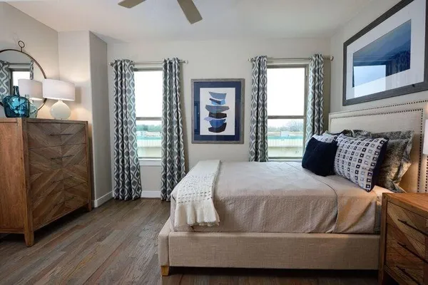 a bedroom with a bed and window