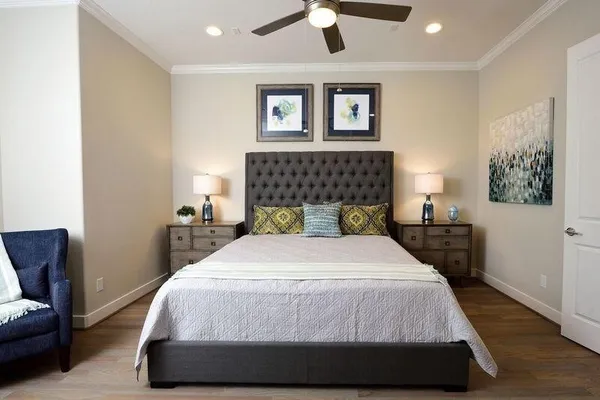 a bedroom with a bed and a couch