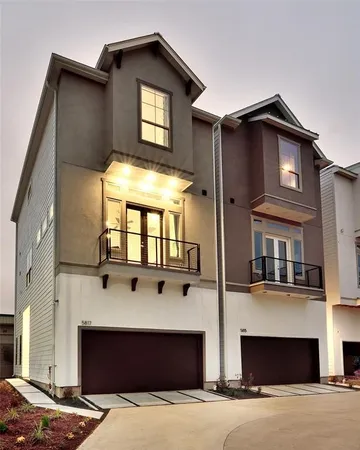 a front view of a house with glass windows