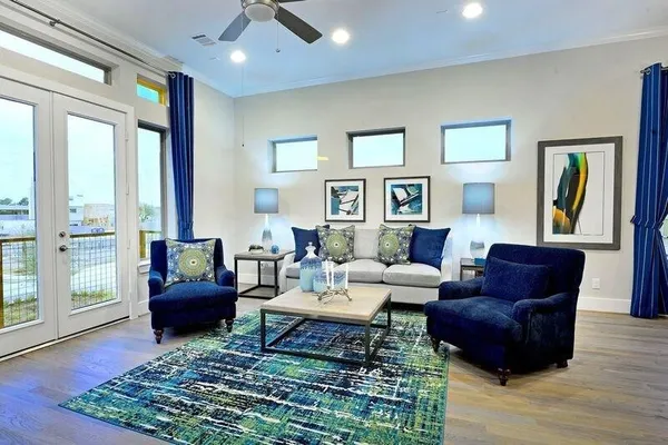 a living room with furniture and a rug