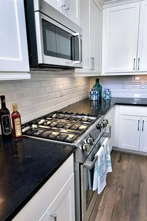 a kitchen with a stove and a microwave