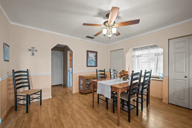 a view of a dining room with furniture and wooden floor