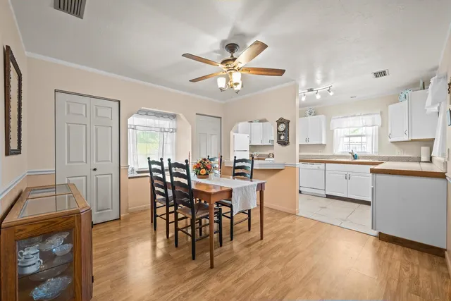 a dining room with furniture and window