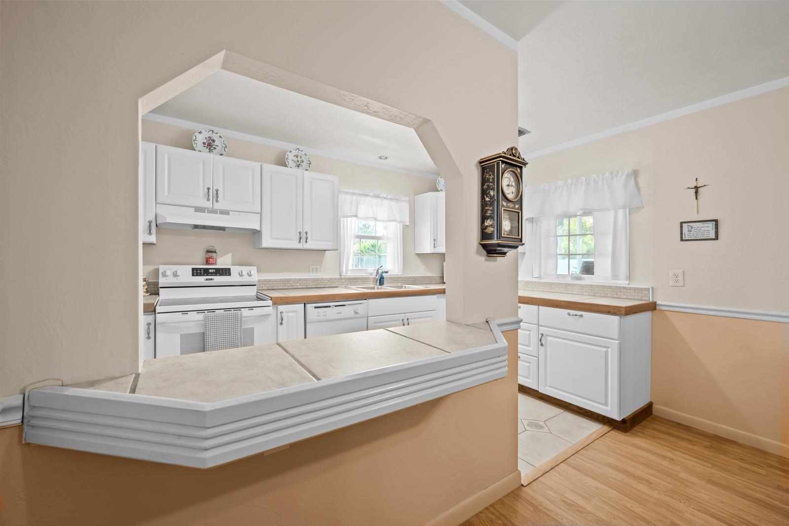 345 Cypress Road St. Augustine, FL 32086 - Photo 19 of 56 a kitchen with granite countertop white cabinets and white appliances