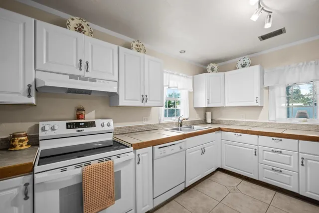 a living room with granite countertop furniture and a large mirror
