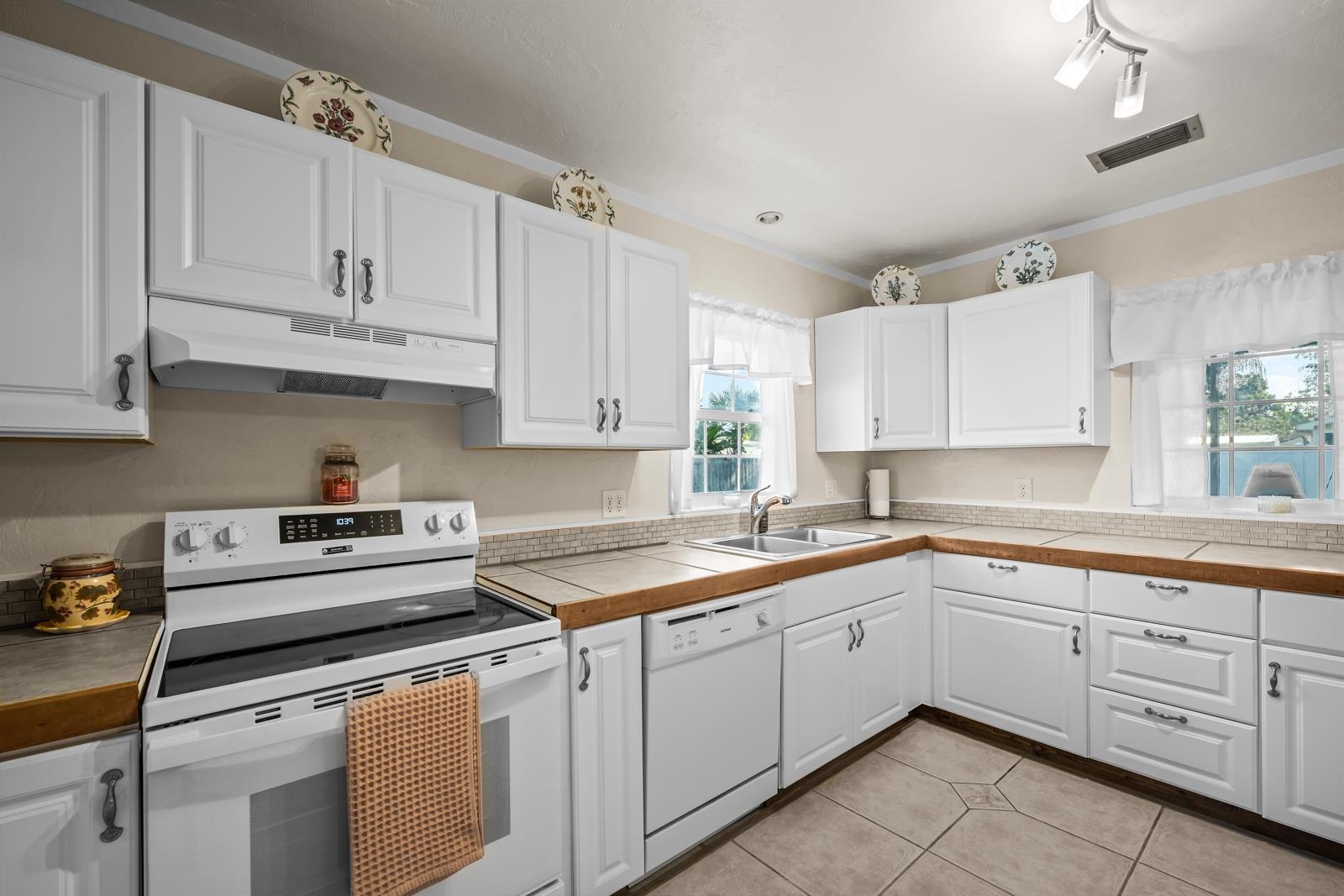 345 Cypress Road St. Augustine, FL 32086 - Photo 21 of 56 a kitchen with cabinets appliances a sink and a counter top