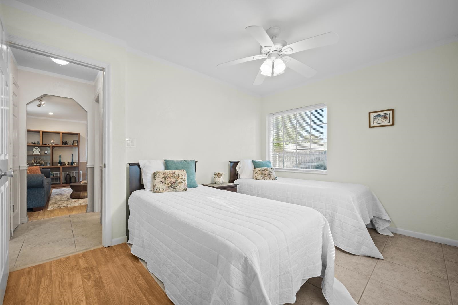 345 Cypress Road St. Augustine, FL 32086 - Photo 26 of 56 a bedroom with a large bed and a chandelier