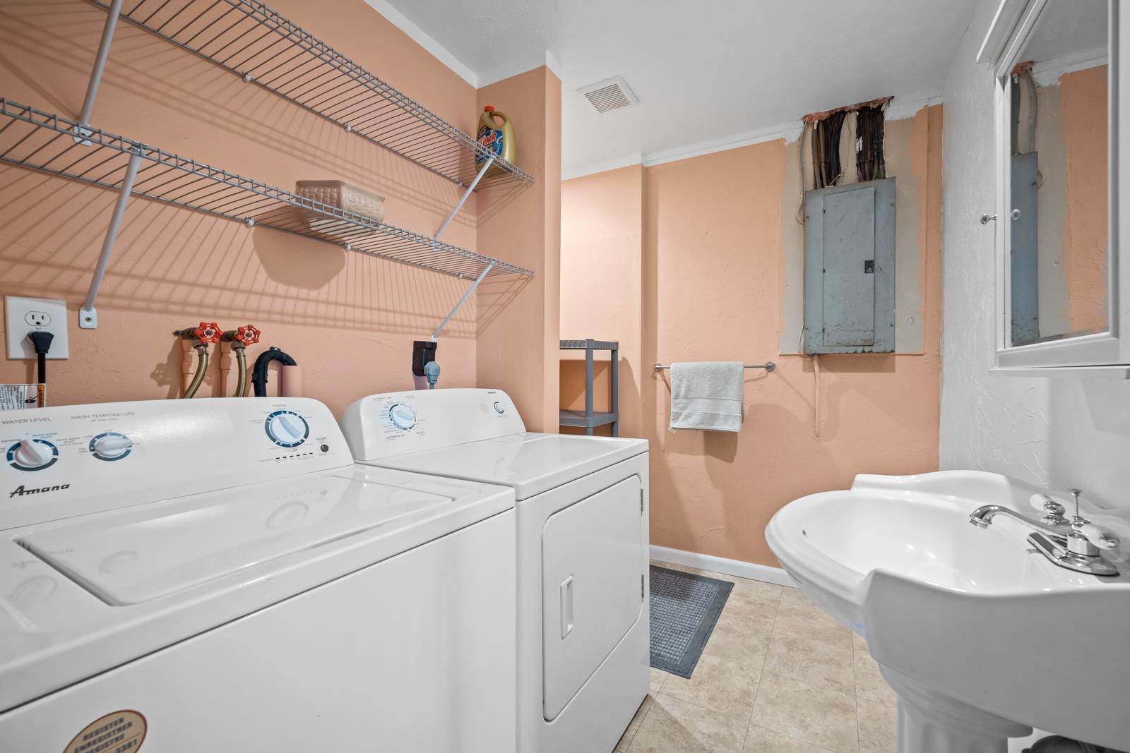 345 Cypress Road St. Augustine, FL 32086 - Photo 27 of 56 a bathroom with a sink and a mirror