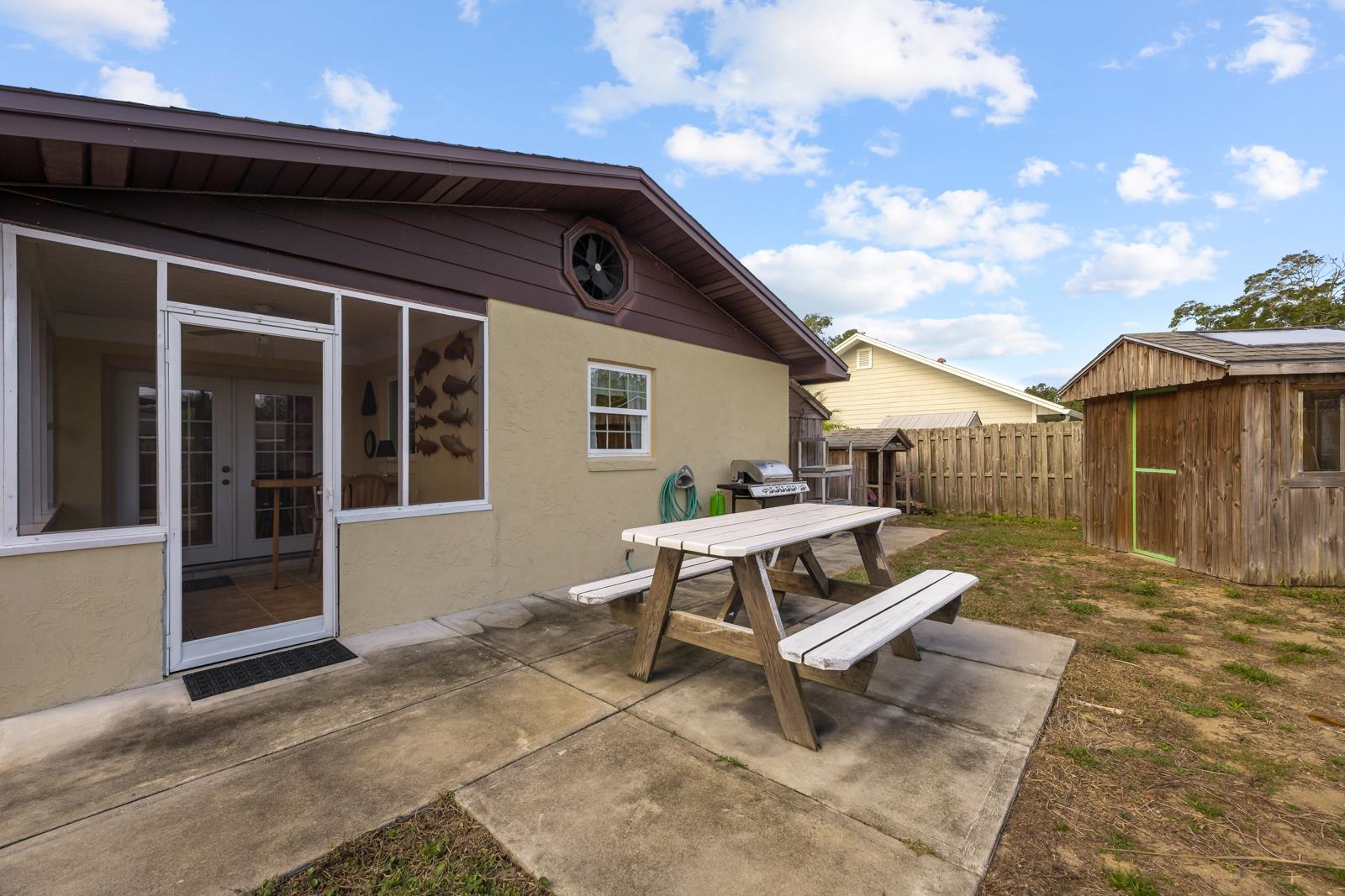 345 Cypress Road St. Augustine, FL 32086 - Photo 31 of 56 a backyard of a house with outdoor seating