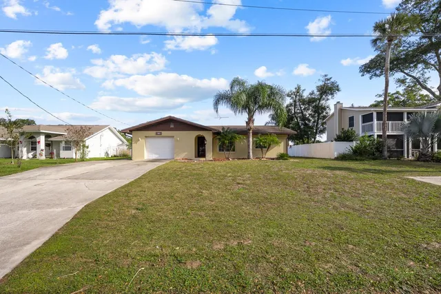 a view of a swimming pool with lounge chairs