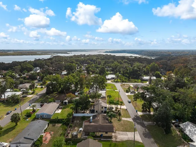 an aerial view of residential houses with outdoor space