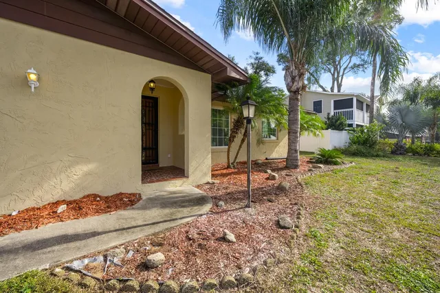 a room with window and a chandelier