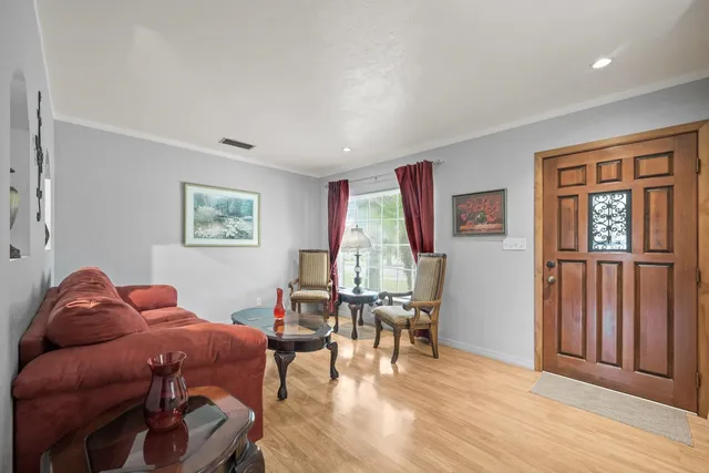 a living room with furniture and a large window