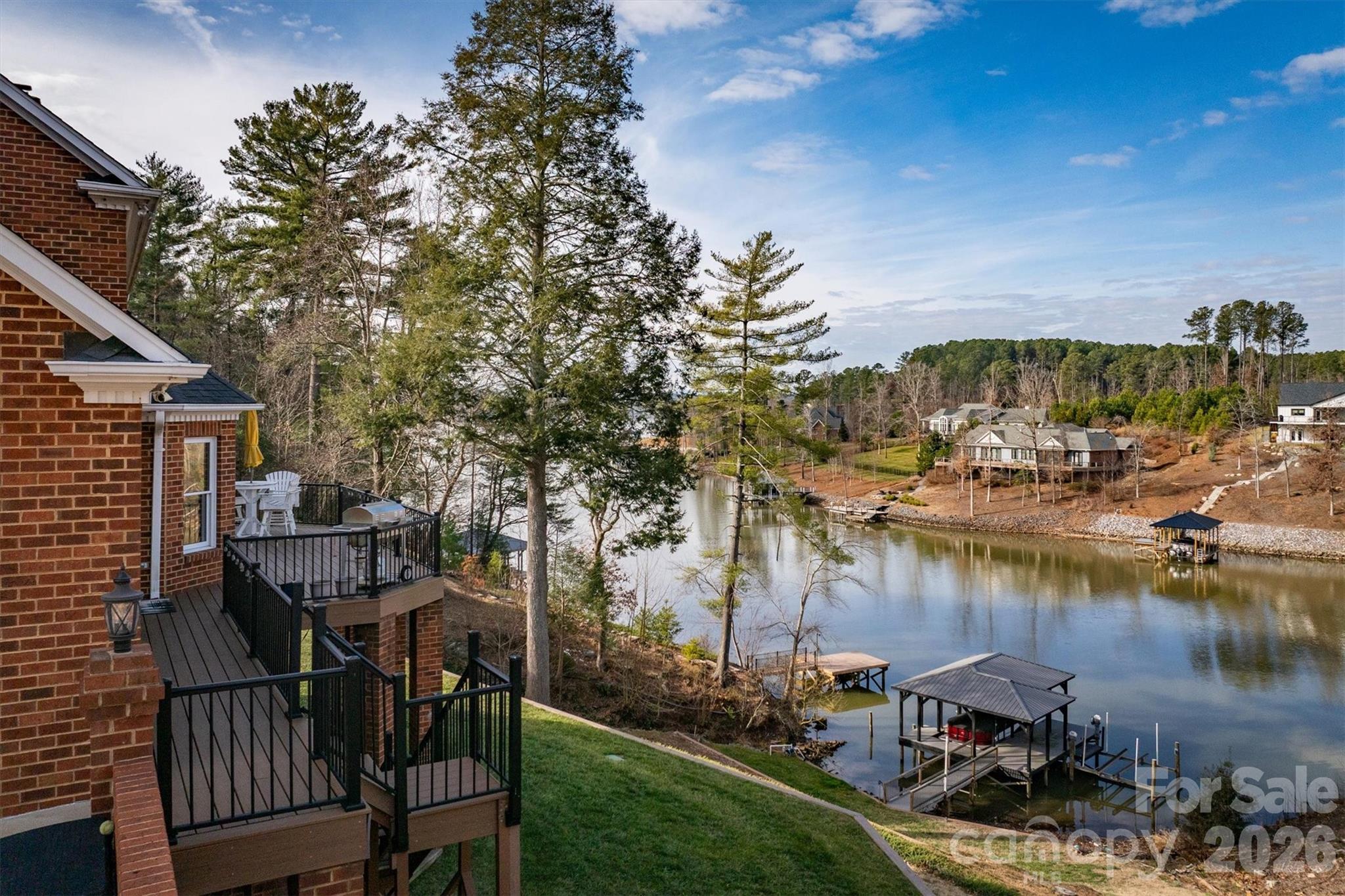 46 Mariners Point Lane Hickory, NC 28601 - Photo 4 of 43 a view of a lake with a table and chairs