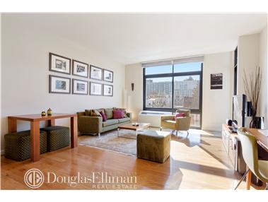 48-21 5th Street, Unit 4C Queens, NY 11101 - Photo 1 of 1 a living room with furniture window and a flat screen tv