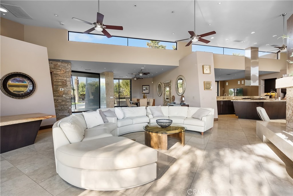 68 Royal St Georges Way Rancho Mirage, CA 92270 - Photo 43 of 75 a living room with furniture and a fireplace
