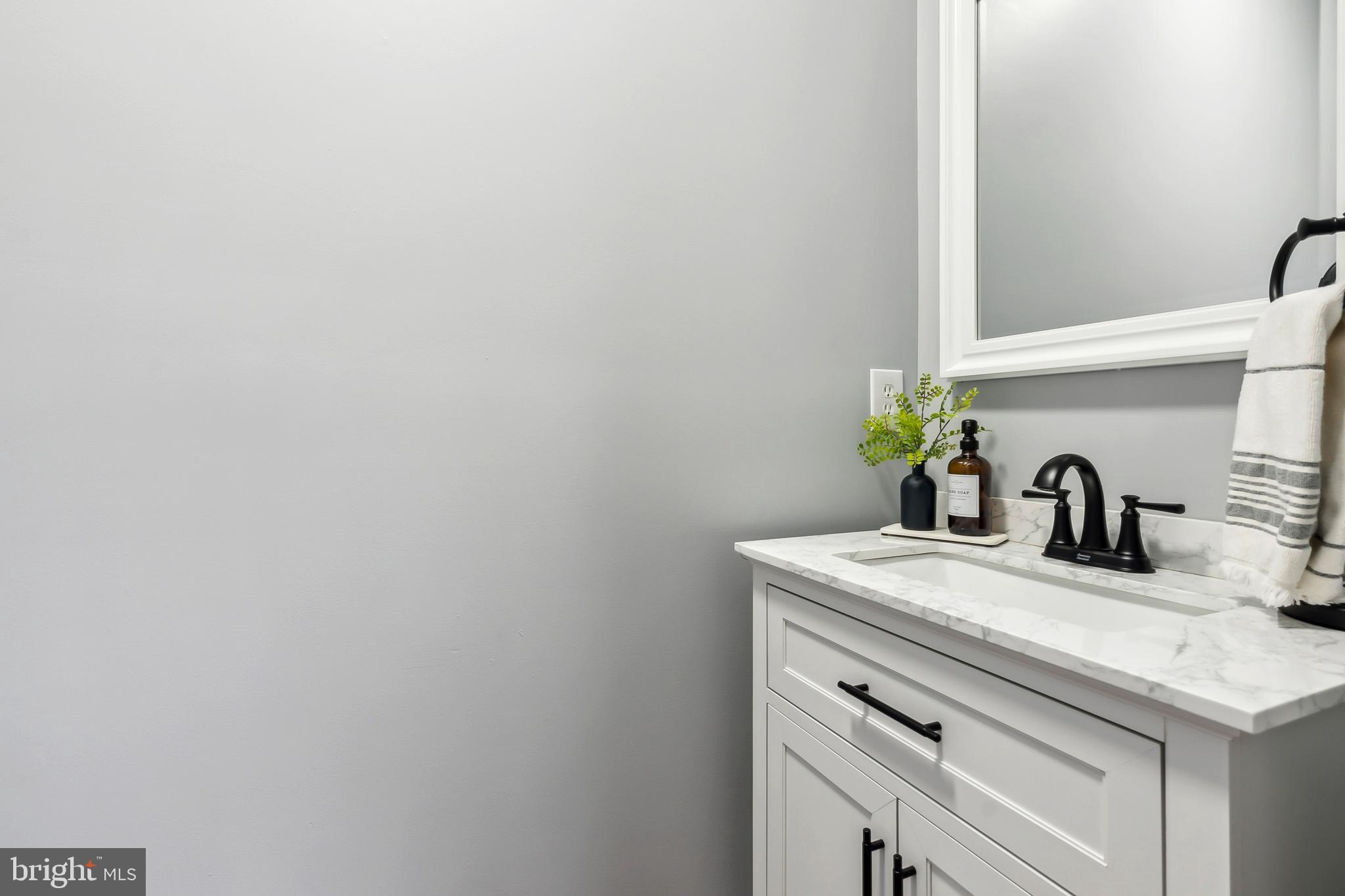 28 Teal Court Riverside, NJ 08075 - Photo 11 of 24 a bathroom with a sink and a vanity