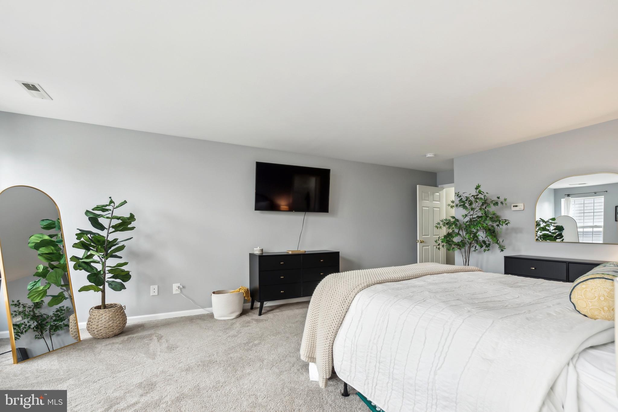 28 Teal Court Riverside, NJ 08075 - Photo 13 of 24 a bedroom with a bed a couch and potted plant