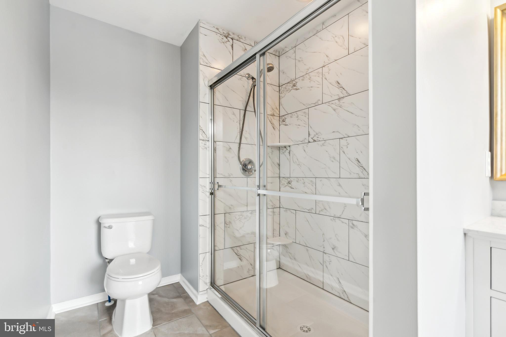 28 Teal Court Riverside, NJ 08075 - Photo 16 of 24 a bathroom with a toilet and a shower