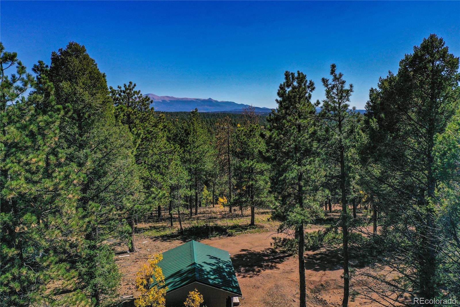 3447 Pathfinder Road Florissant, CO 80816 - Photo 15 of 40 a view of a lake with sitting area