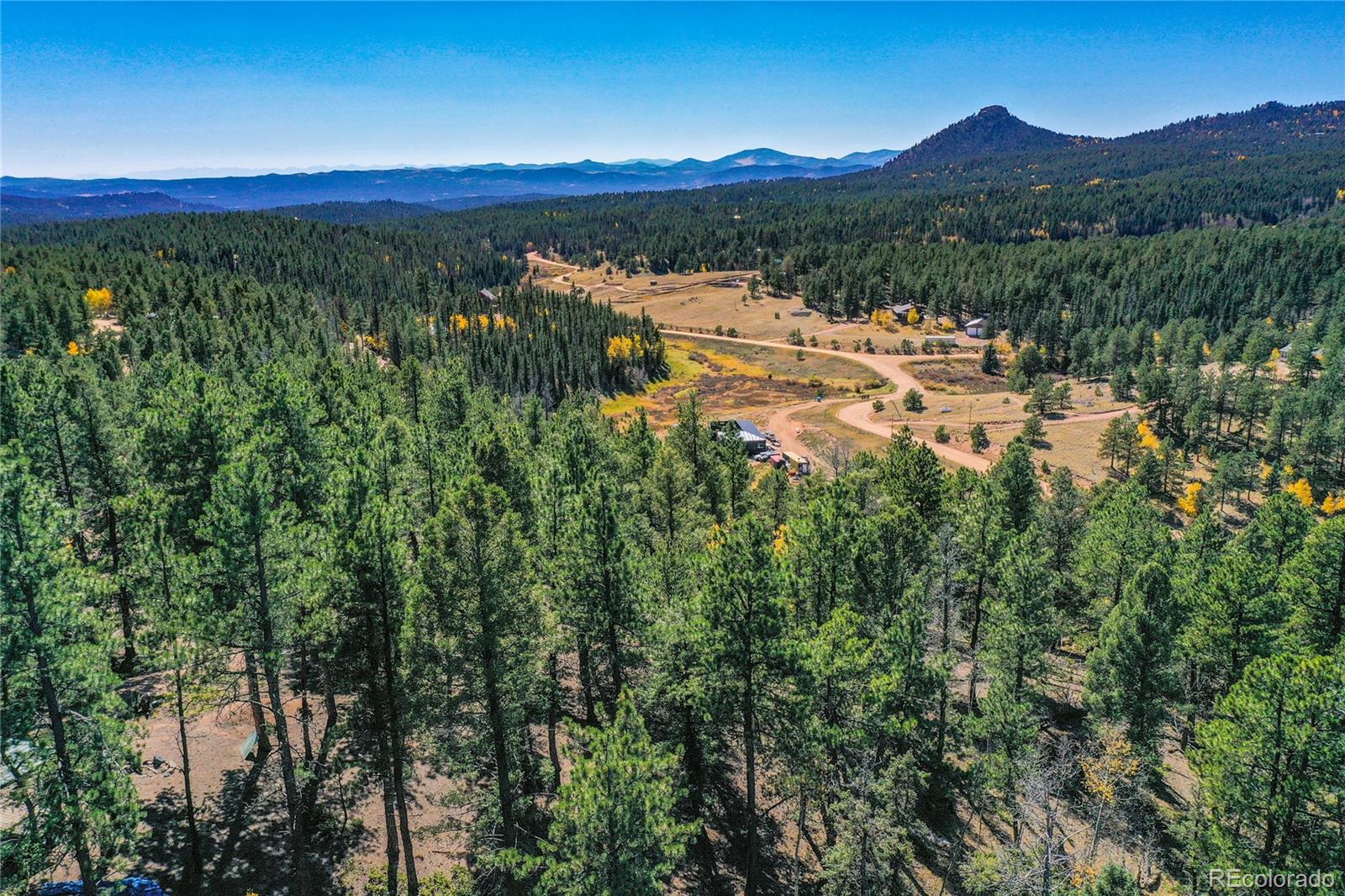 3447 Pathfinder Road Florissant, CO 80816 - Photo 32 of 40 a view of a city with a mountain