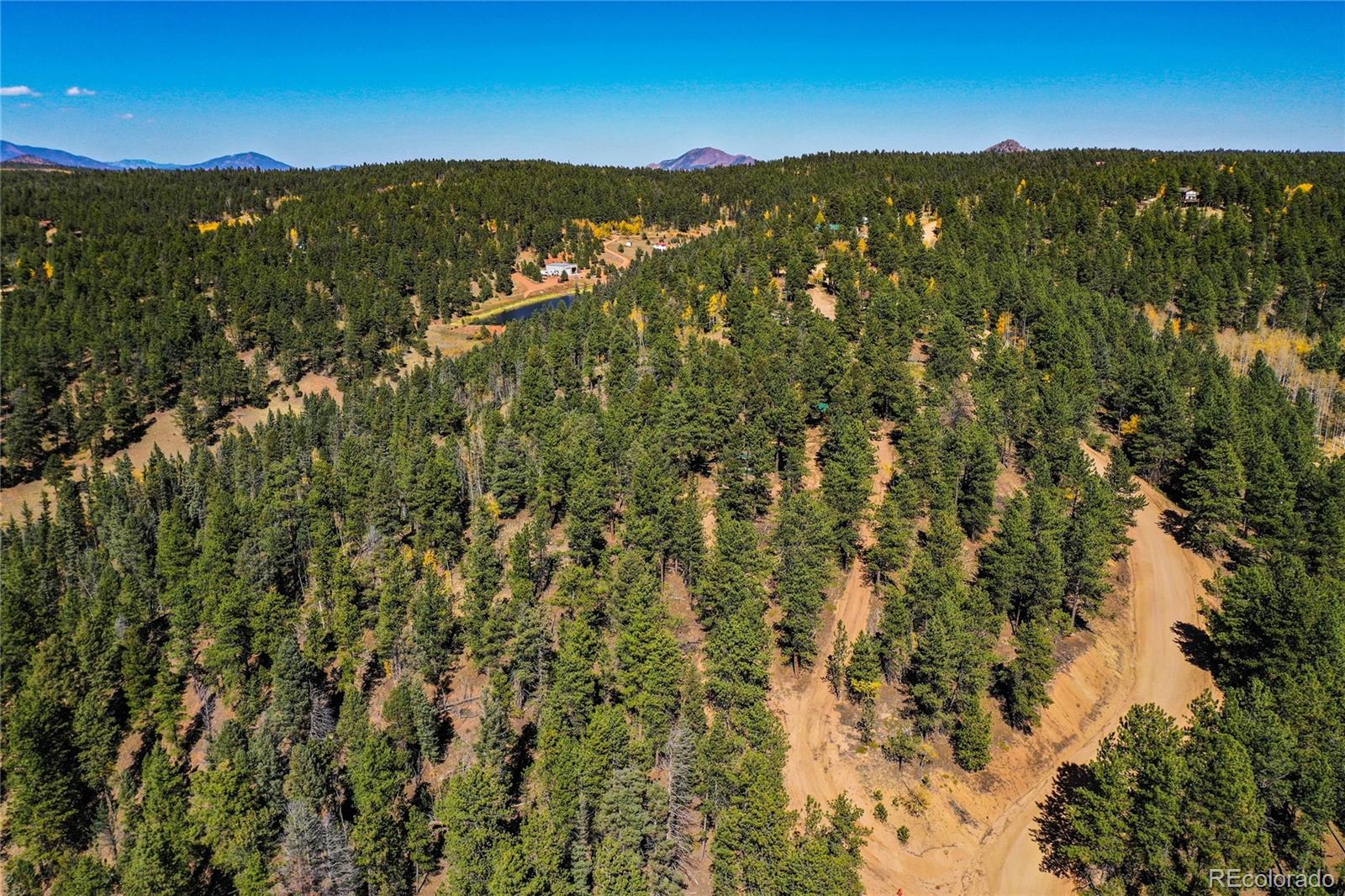 3447 Pathfinder Road Florissant, CO 80816 - Photo 36 of 40 a view of a city with mountains in the background