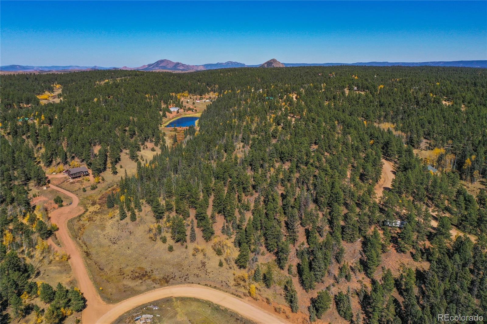 3447 Pathfinder Road Florissant, CO 80816 - Photo 38 of 40 a view of a city with mountains in the background