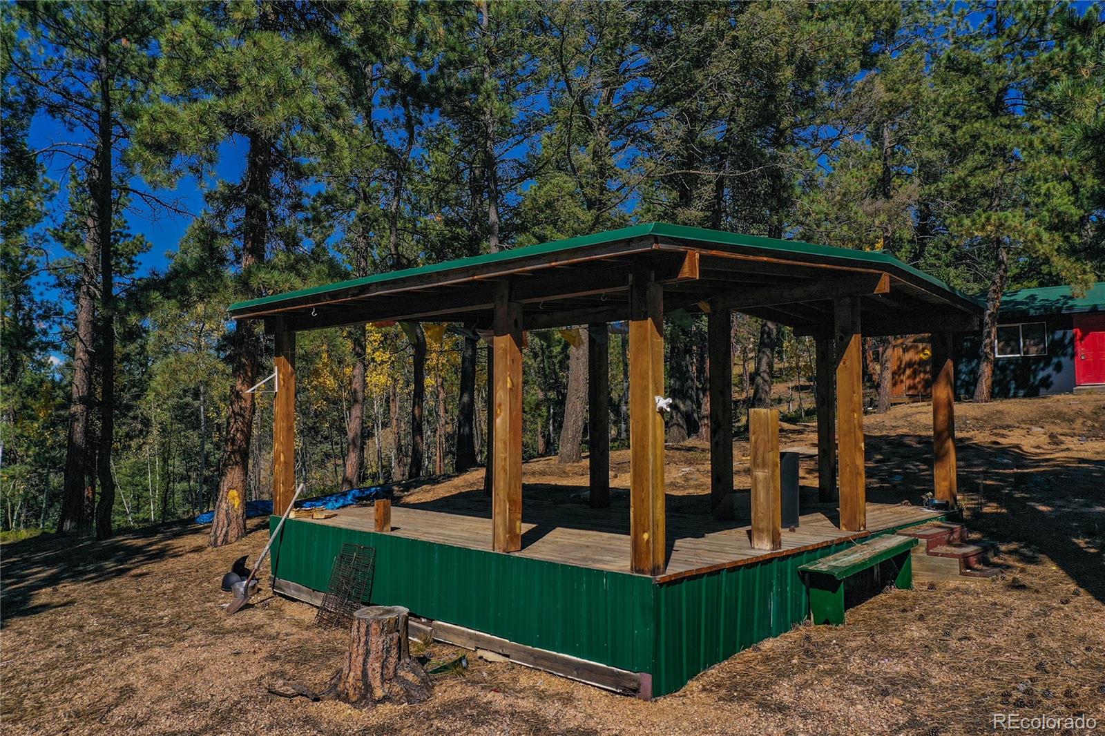 3447 Pathfinder Road Florissant, CO 80816 - Photo 8 of 40 a view of a roof deck with wooden fence and floor