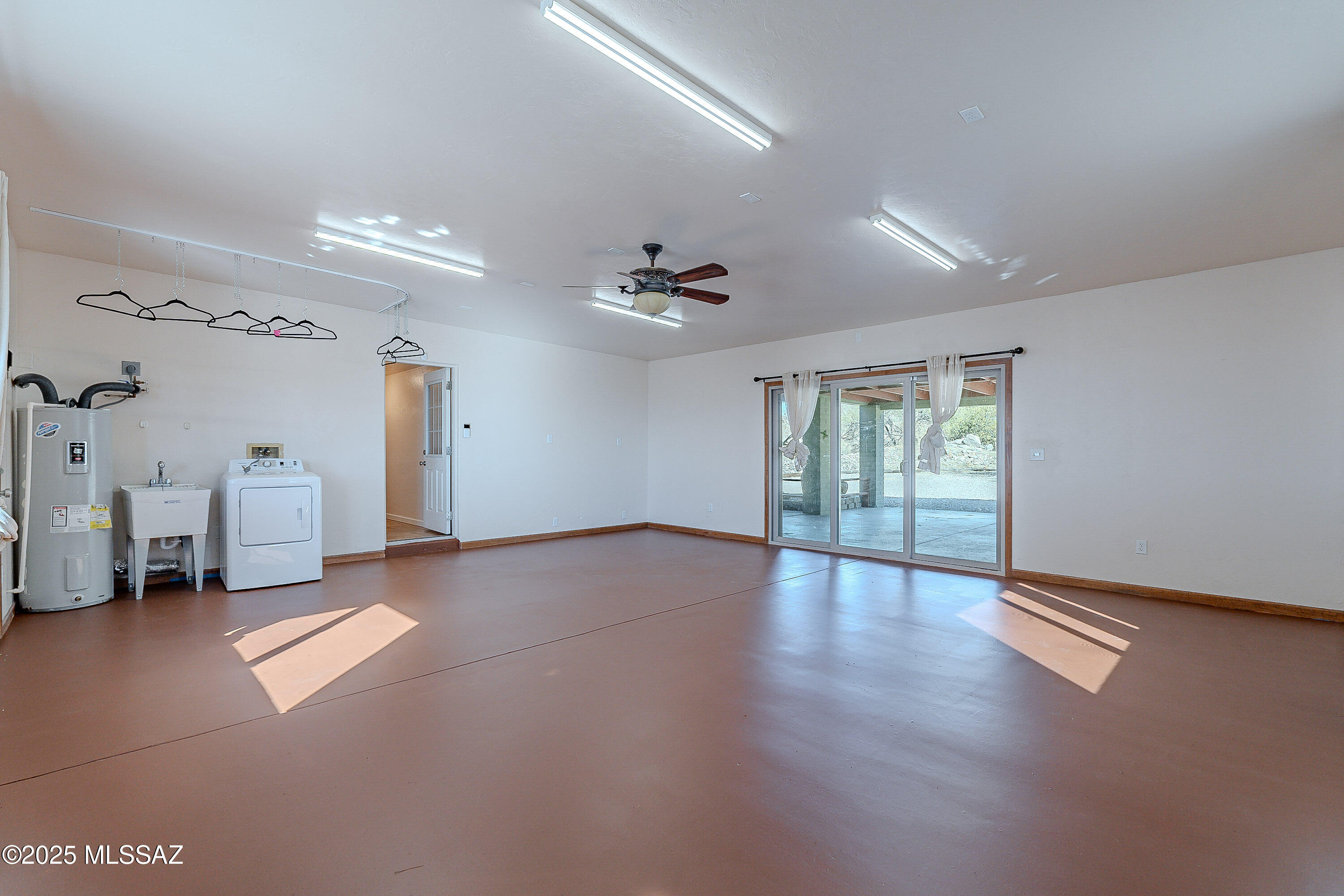 467 Camino Osito Rio Rico, AZ 85648 - Photo 41 of 50 a view of an empty room with a window and wooden floor