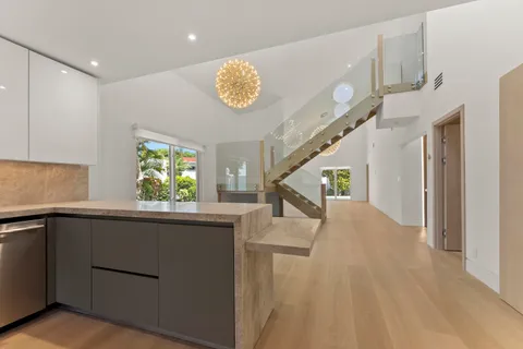 a view of entryway with kitchen and hallway