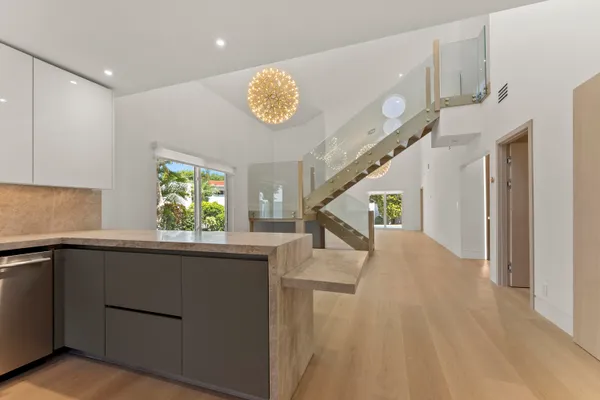a view of entryway with kitchen and hallway