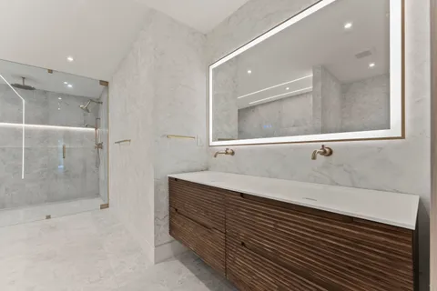 a bathroom with a bathtub and a shower