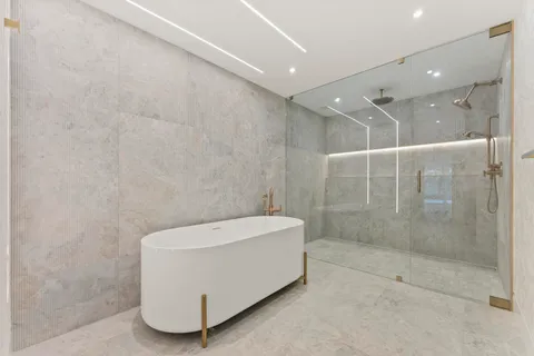 a bathroom with a shower and a bathtub