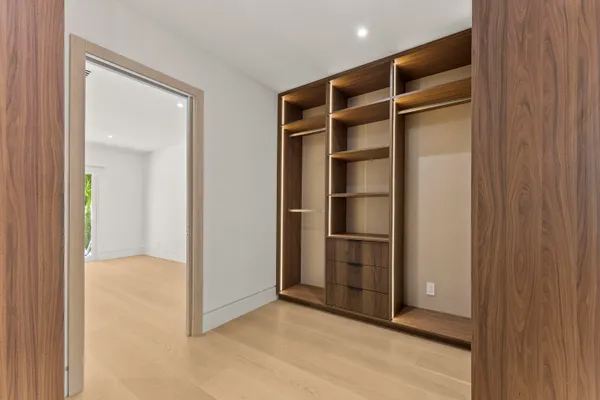 a view of an empty room with closet area