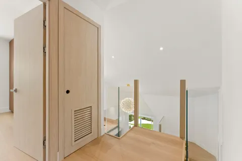 a view of a hallway with paintings on the walls