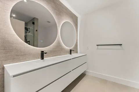 a bathroom with a sink and mirror