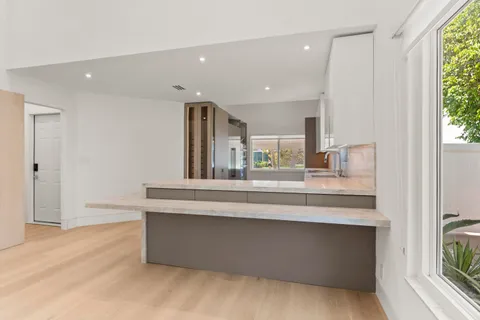 a view of living room with granite countertop furniture and fireplace