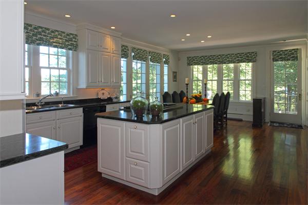 67 Sandy Pond Road Lincoln, MA 01773 - Photo 5 of 21 a kitchen with sink a stove and cabinets