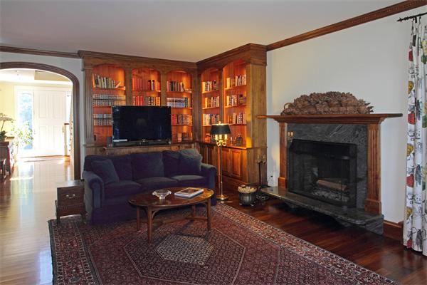 67 Sandy Pond Road Lincoln, MA 01773 - Photo 9 of 21 a living room with furniture a flat screen tv and a fireplace