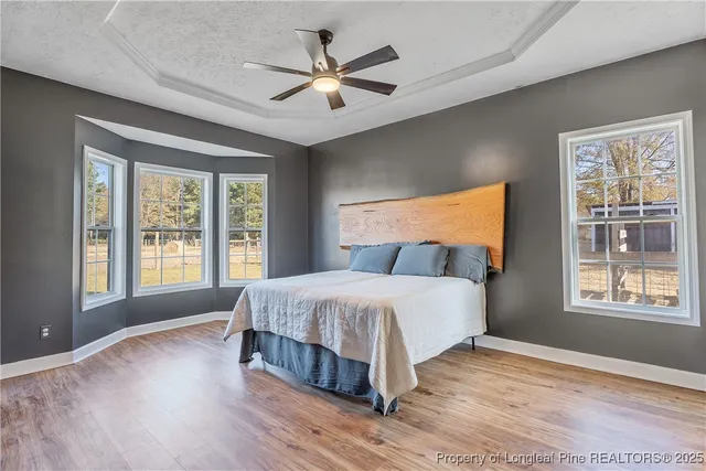 a bedroom with a large bed and a large window