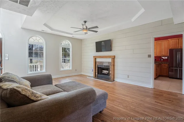 a living room with furniture and a fireplace