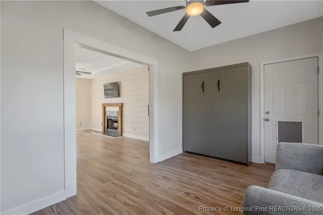 a view of livingroom with hardwood floor and ceiling fan
