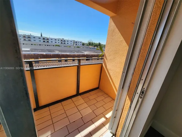 a view of balcony with furniture