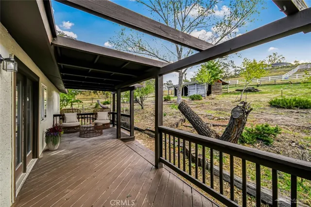 a view of a two chairs in the balcony