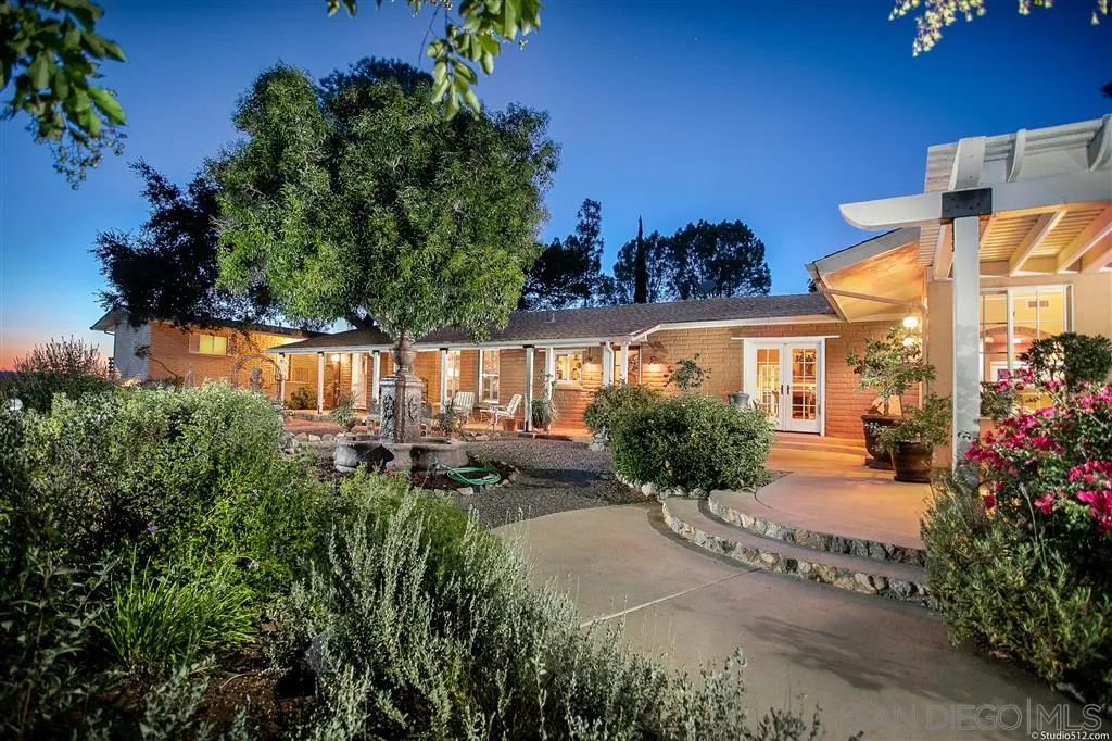 15738 Vesper Road Valley Center, CA 92082 - Photo 1 of 25 view of a house with sitting area and garden