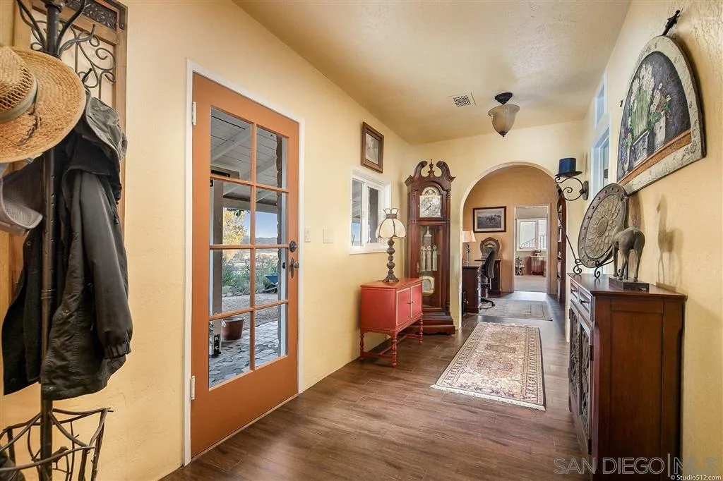 15738 Vesper Road Valley Center, CA 92082 - Photo 12 of 25 a view of living room filled with furniture and wooden floor