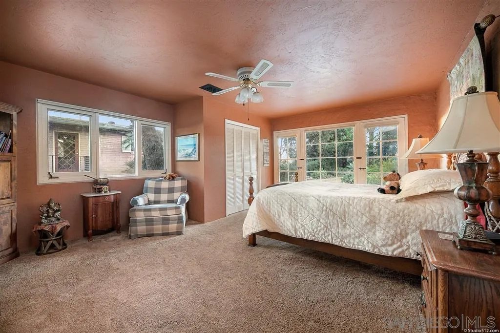 15738 Vesper Road Valley Center, CA 92082 - Photo 14 of 25 a bed room with a bed and a chandelier