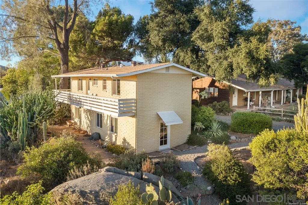 15738 Vesper Road Valley Center, CA 92082 - Photo 17 of 25 a front view of a house with a yard and garage