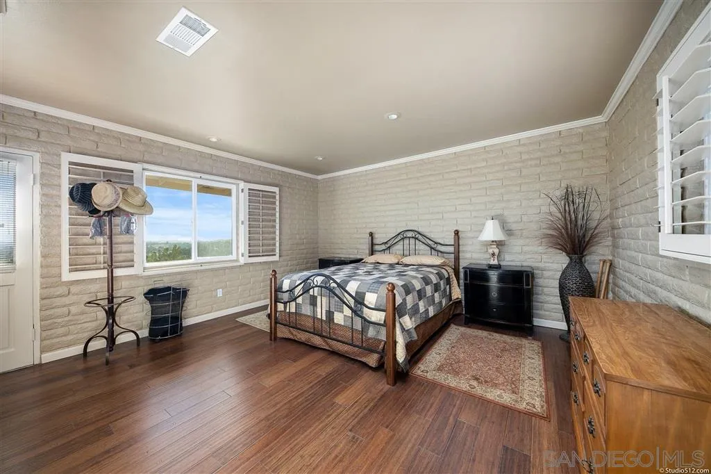 15738 Vesper Road Valley Center, CA 92082 - Photo 20 of 25 a bedroom with a bed and a window